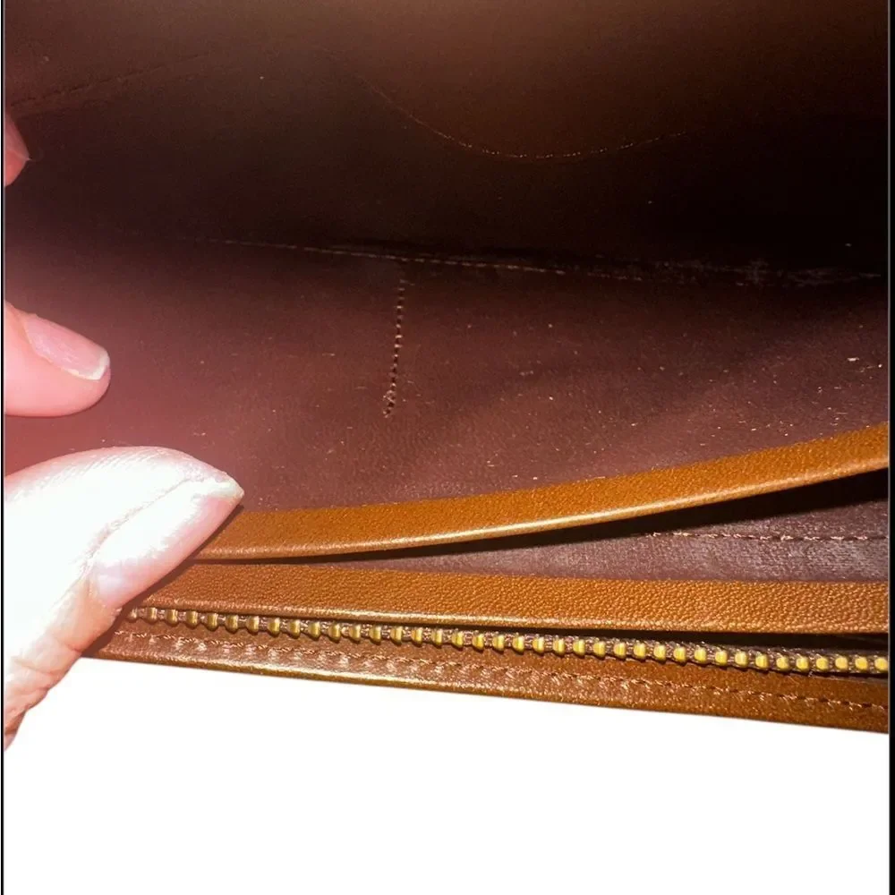 Yves Saint Laurent Tan Leather Wallet with Gold Clasp with marks and scratches.